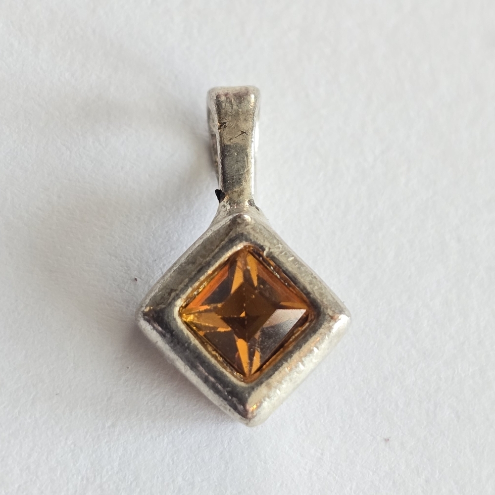 Orange gem pendant silver tone metal diamond shaped jewelry
